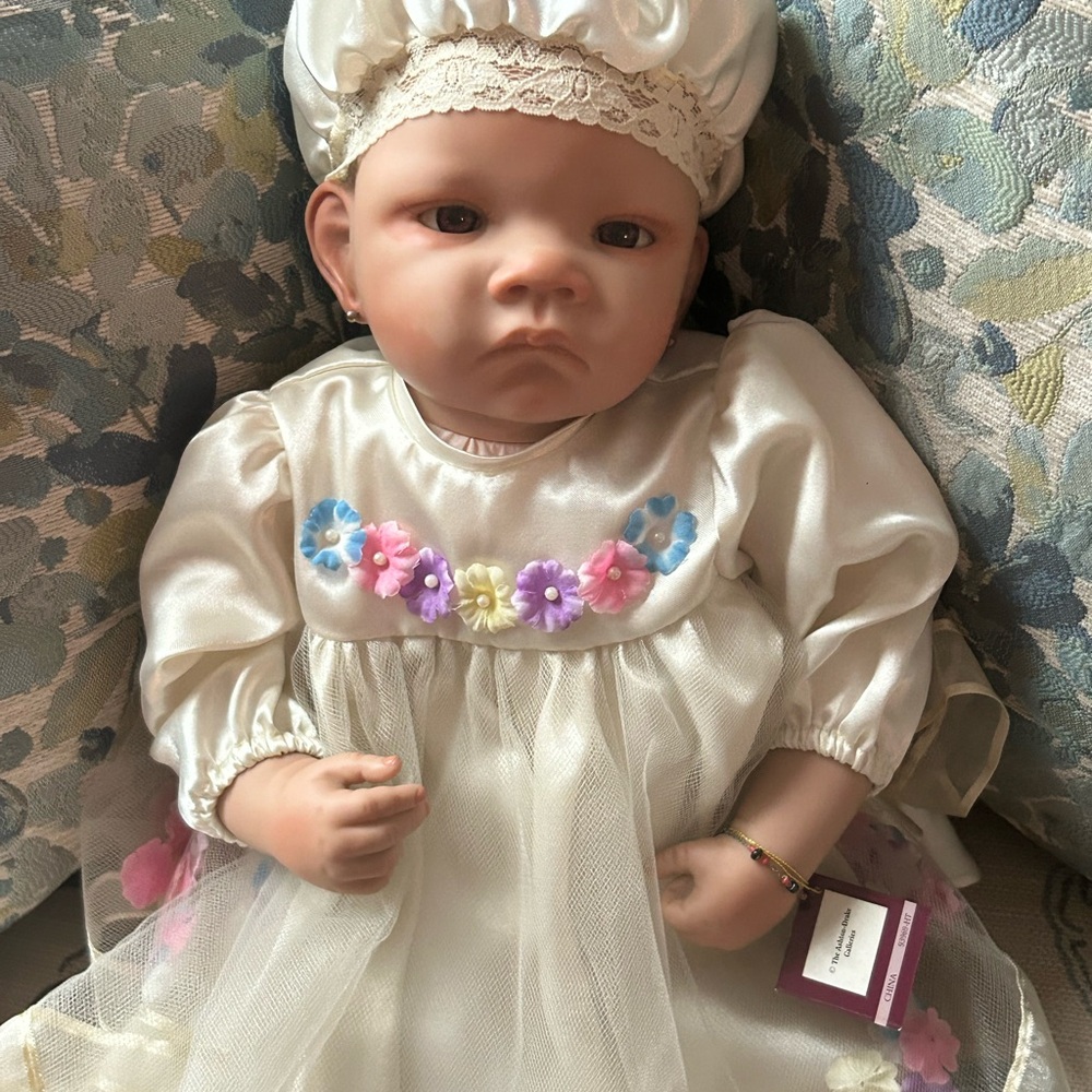 Charming Baby Doll in Cream Dress with Floral Accents